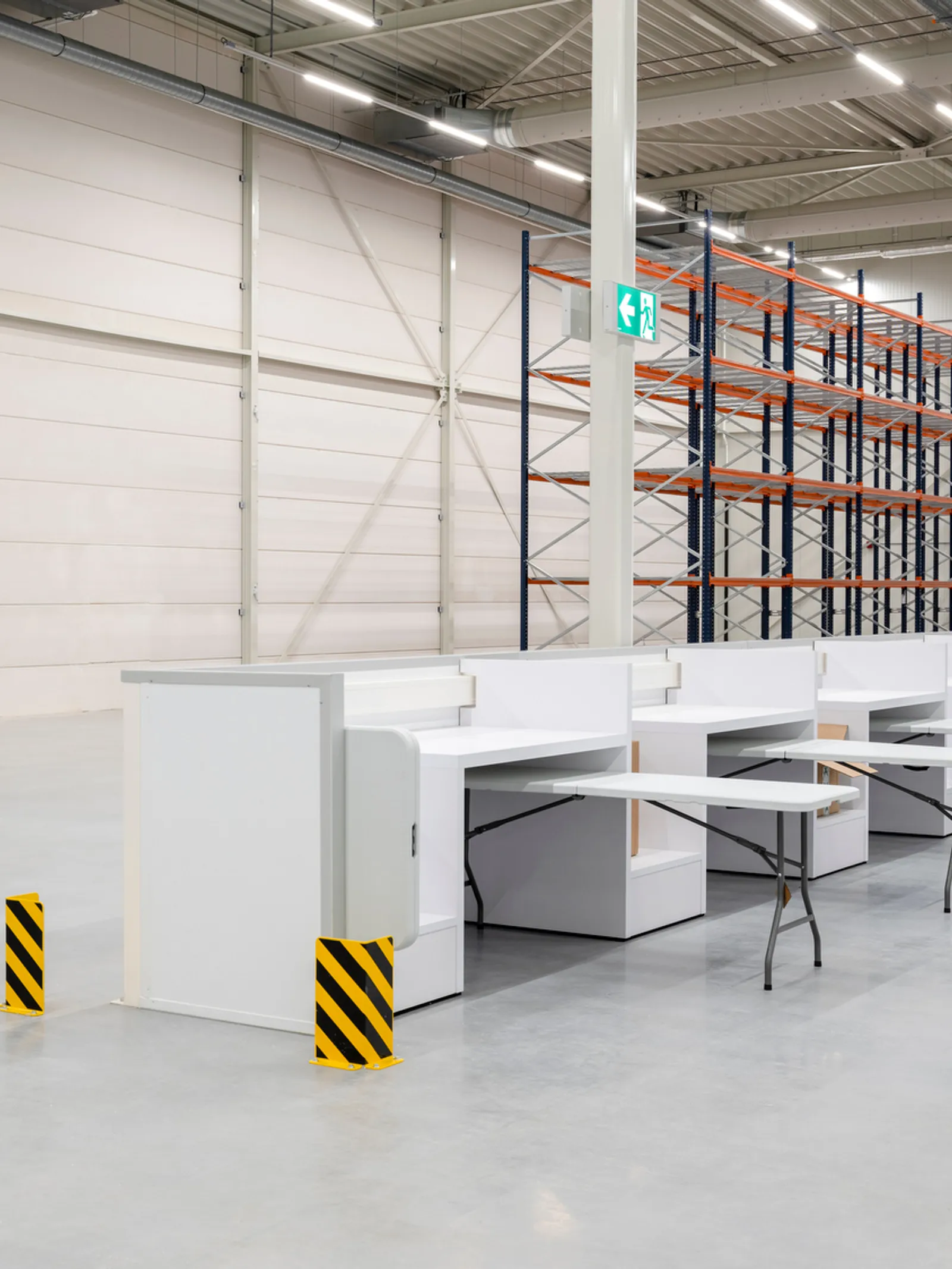 a large industrial shell and core project with a person walking through a warehouse