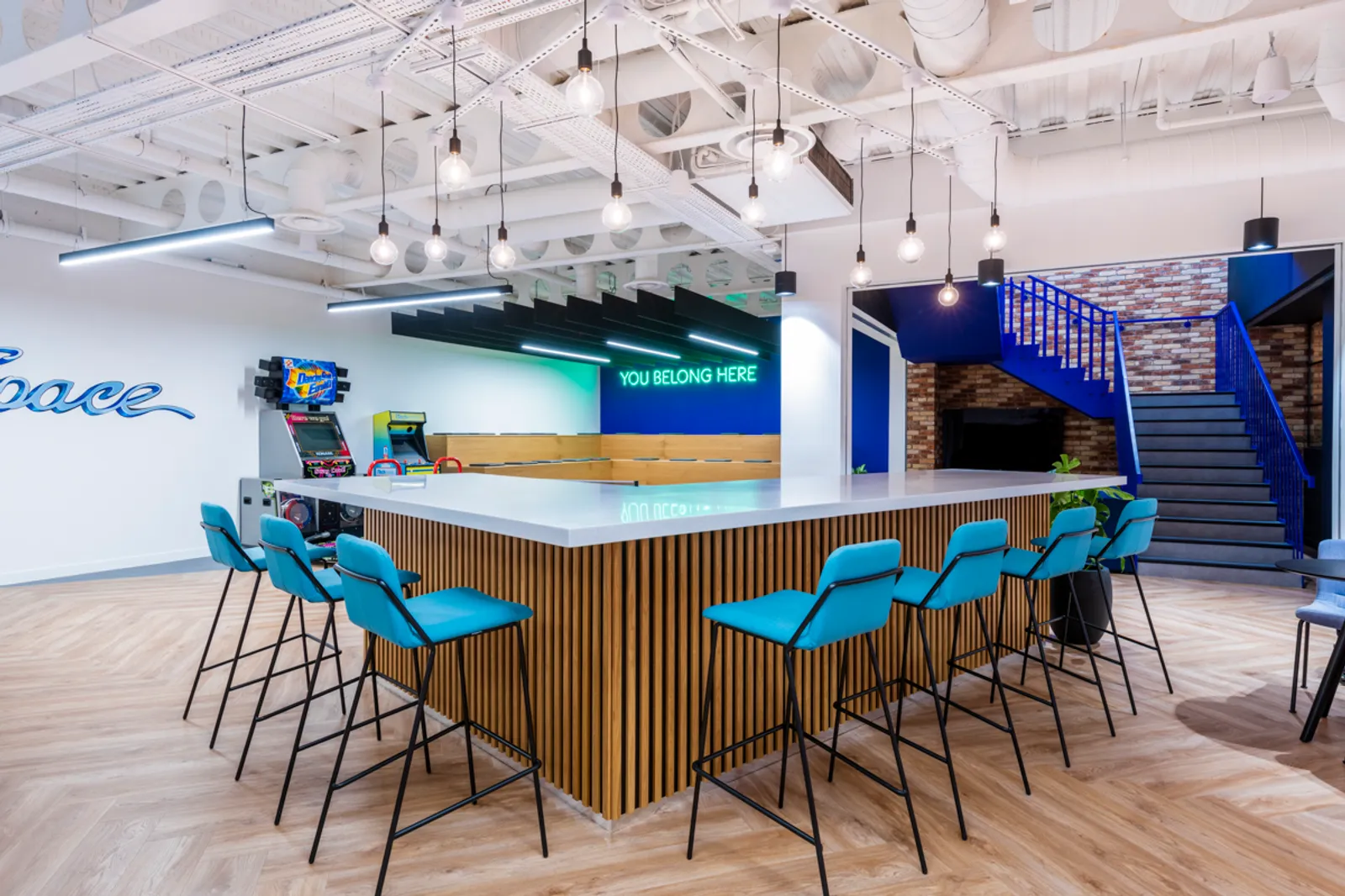 a hybrid working space with high desks and communal area