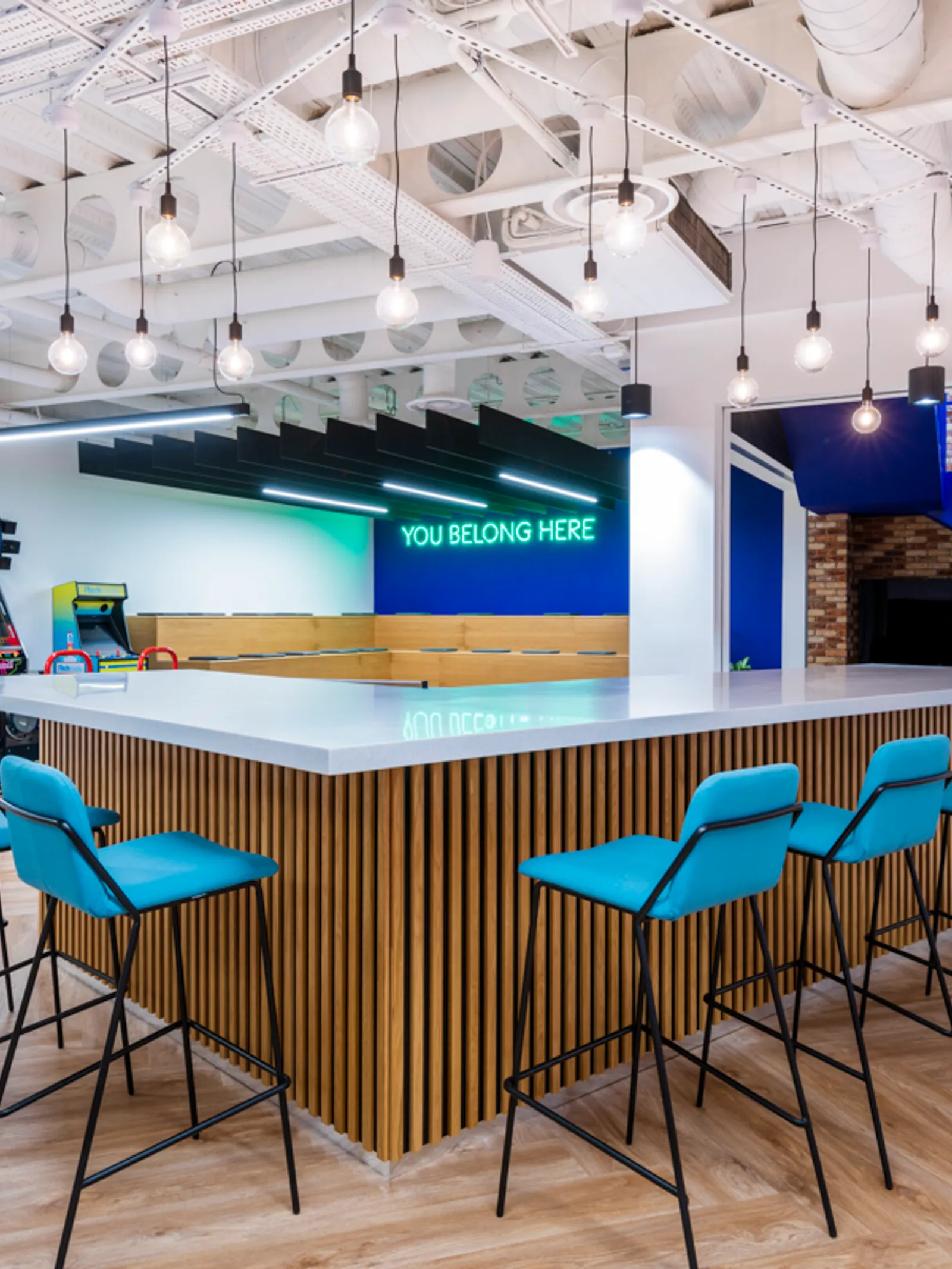 a hybrid working space with high desks and communal area