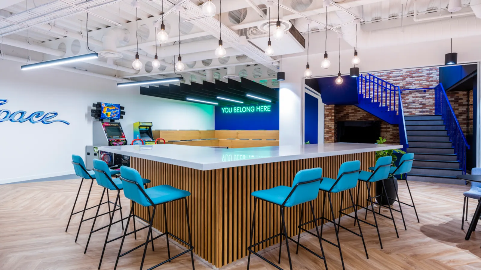 a hybrid working space with high desks and communal area