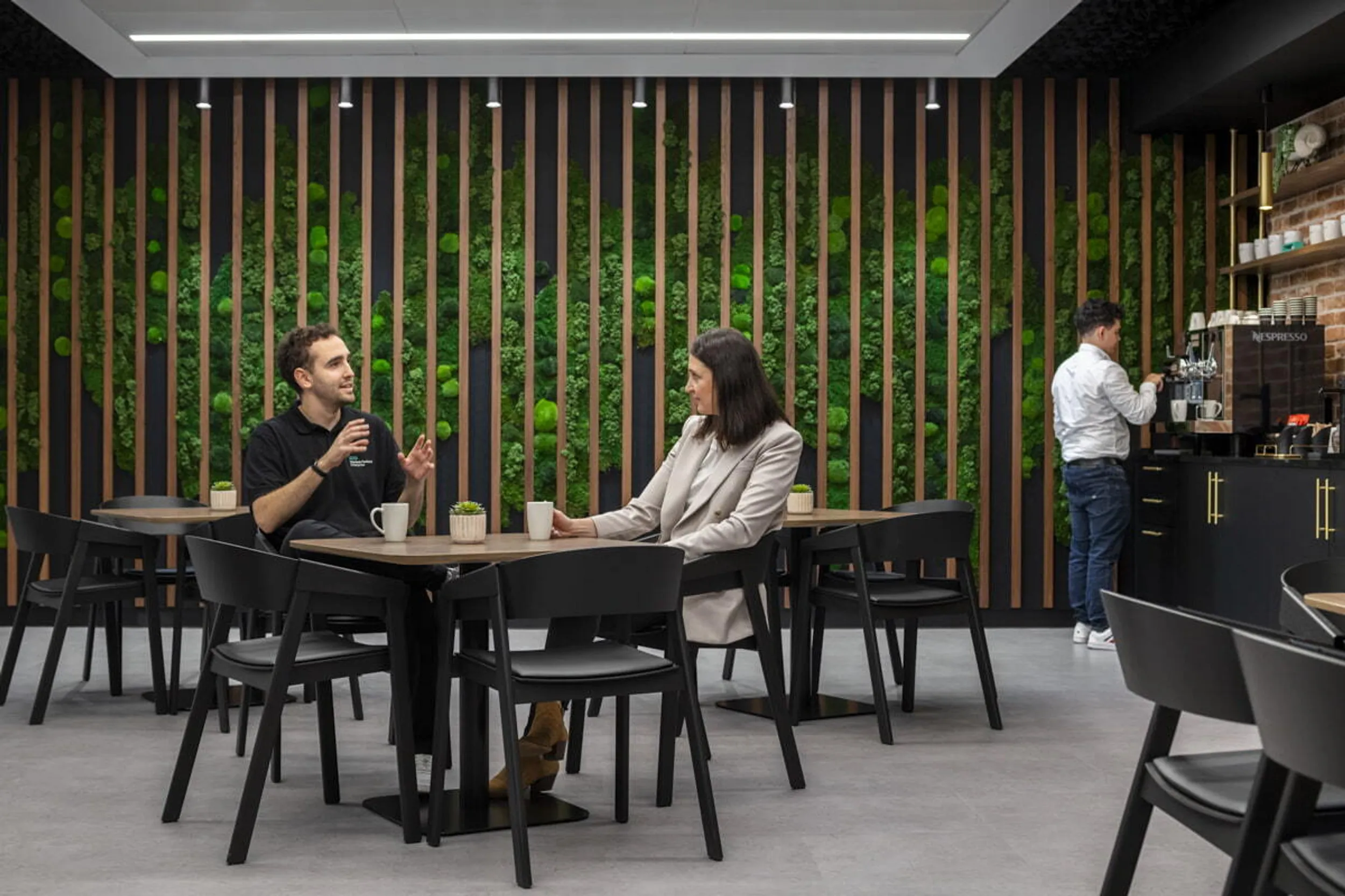 Modern biophilic office break room with comfortable seats