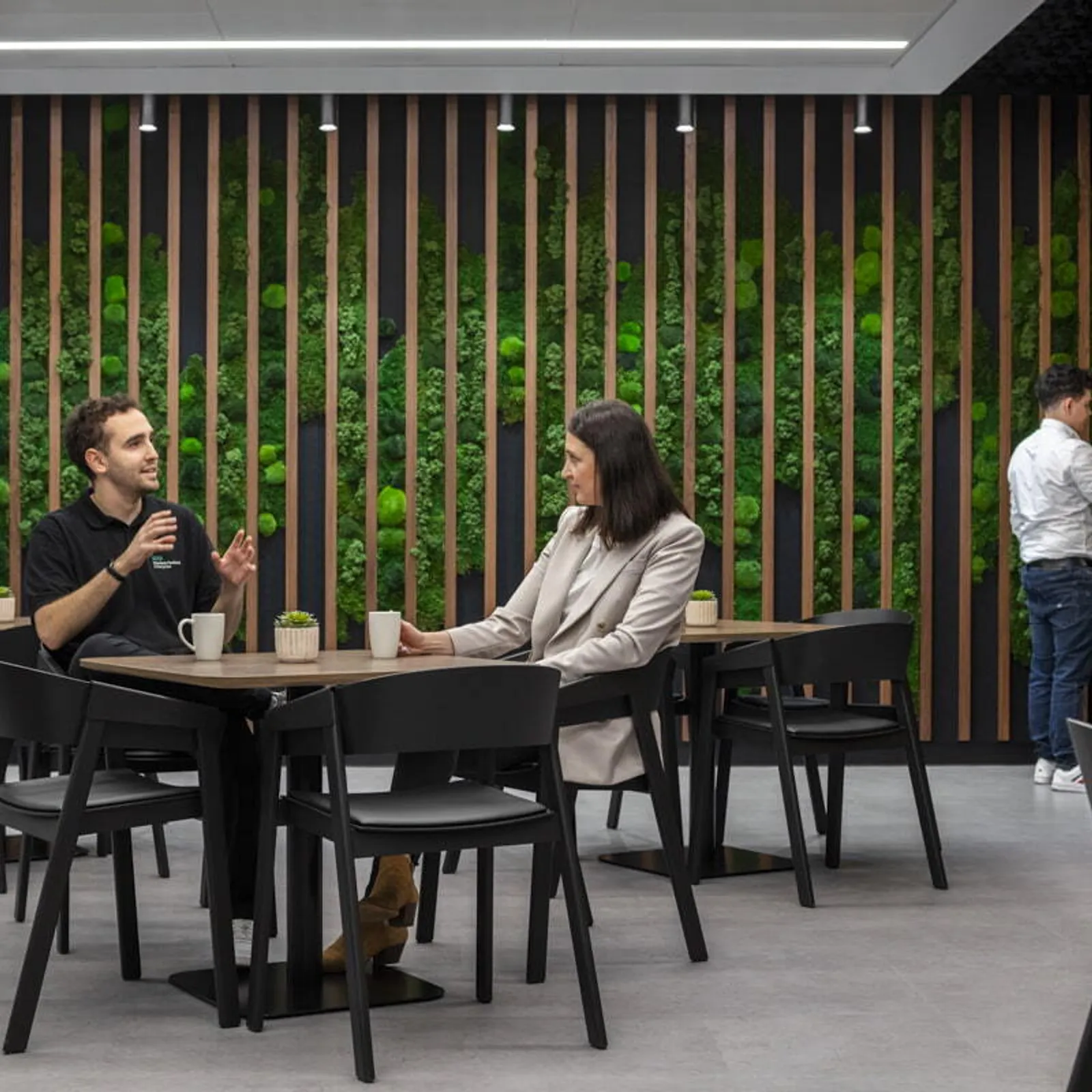 Modern biophilic office break room with comfortable seats