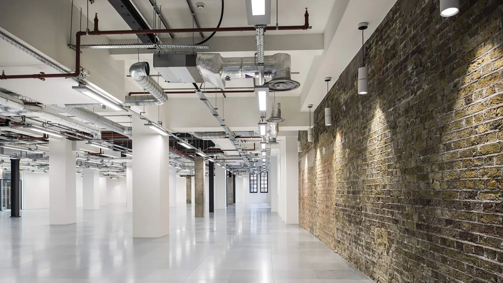 a large shell and core project with exposed brick walls