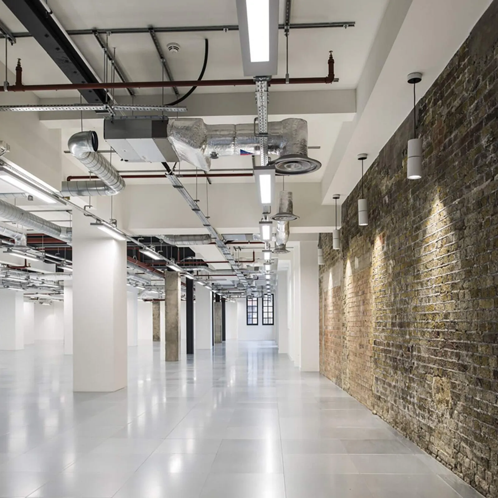 a large shell and core project with exposed brick walls