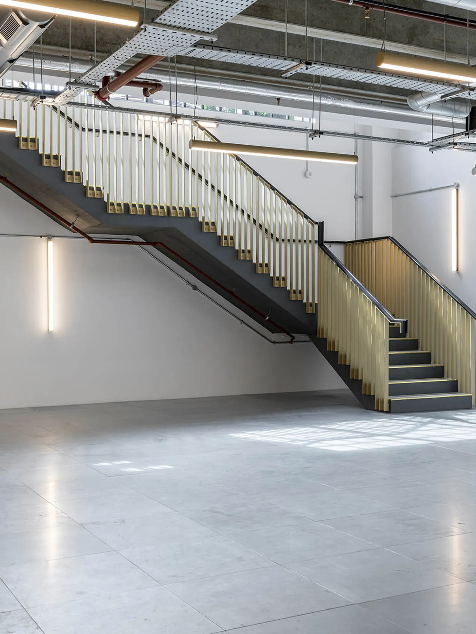 a shell and core with stairs going up to to a new floor