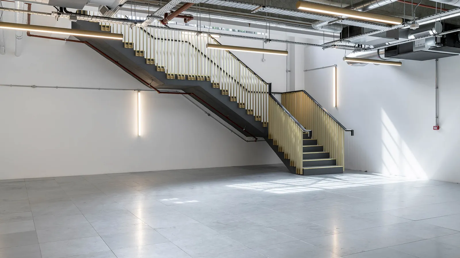 a shell and core with stairs going up to to a new floor