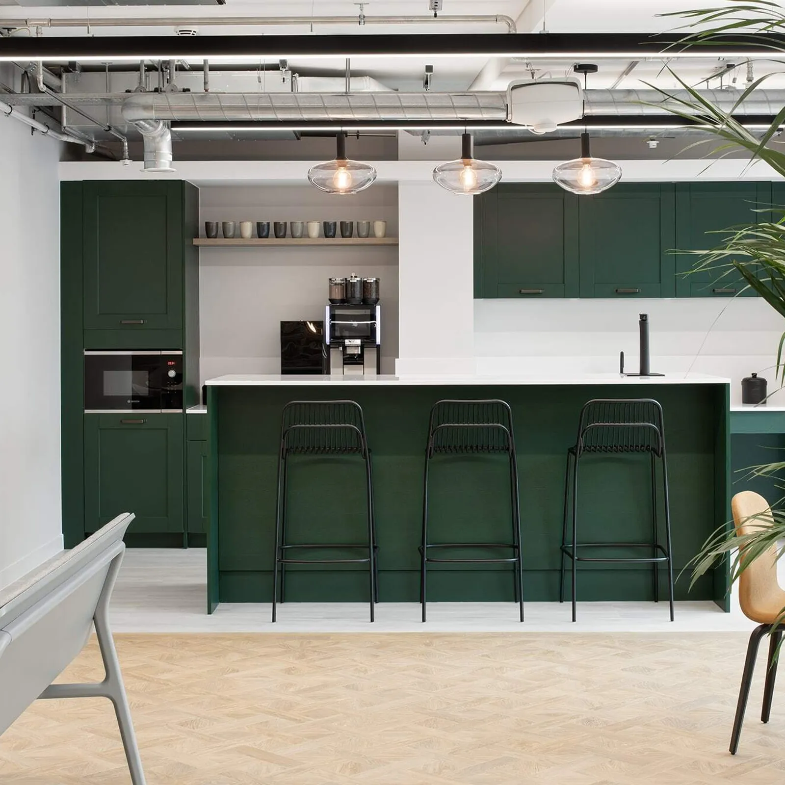 a cat b fit out kitchen area with high-stools and coffee machine