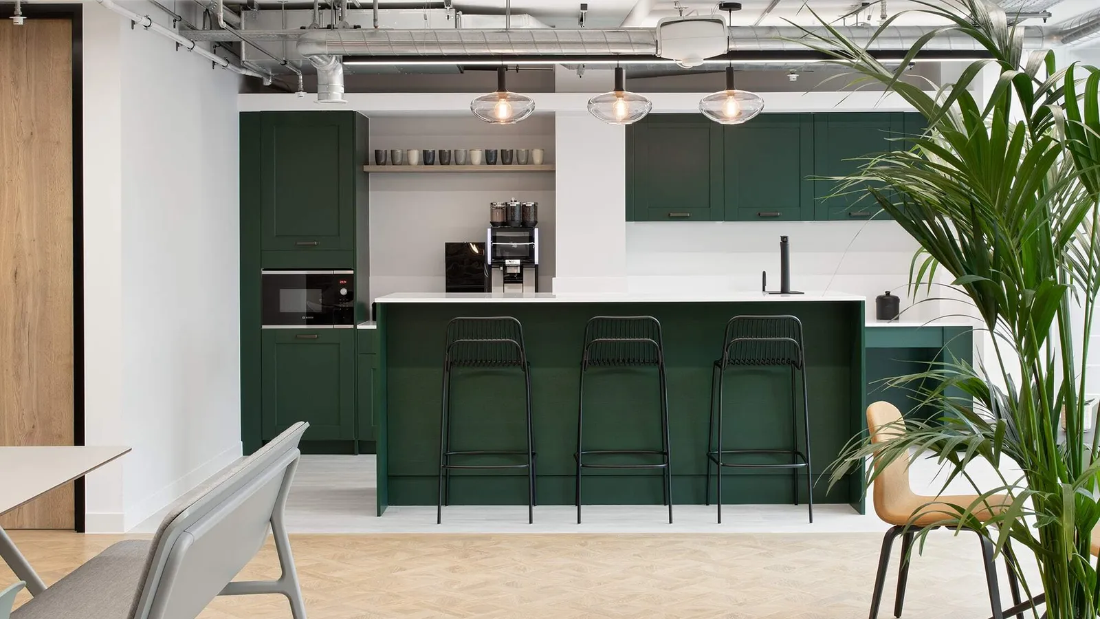 a cat b fit out kitchen area with high-stools and coffee machine