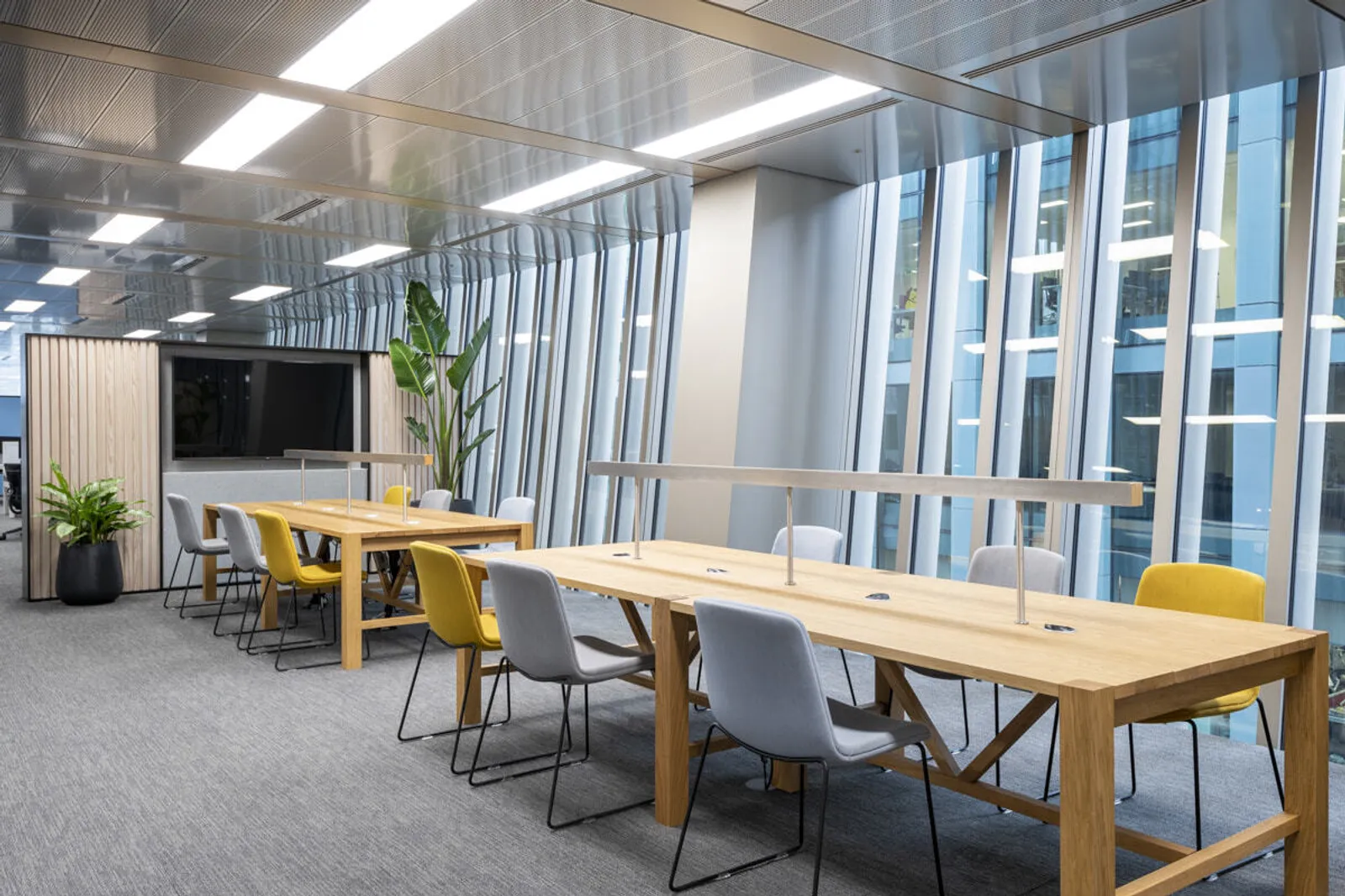 Collaborative London office design, with big windows and long table