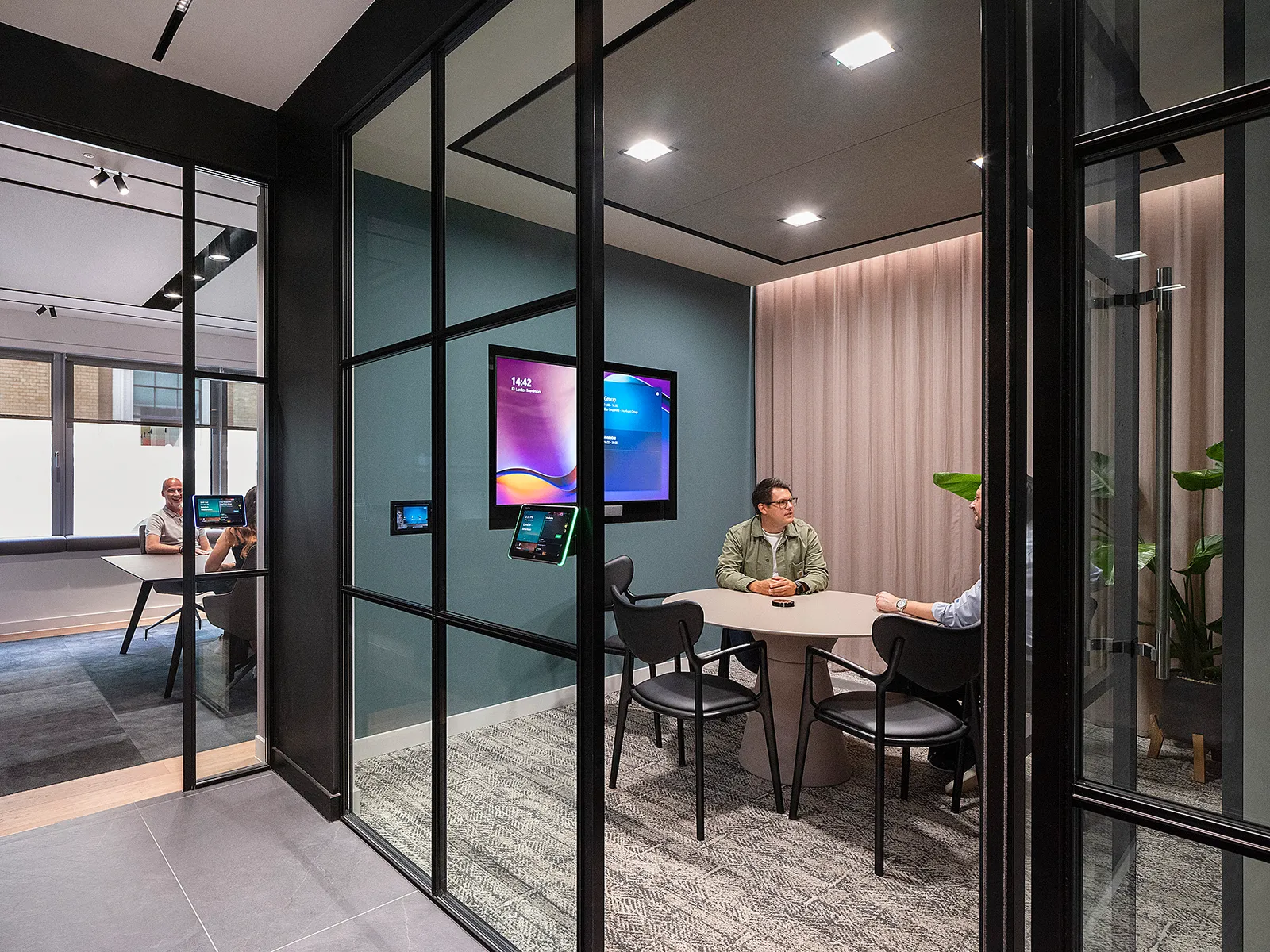 Well lit office space with glass wall for collaborative space
