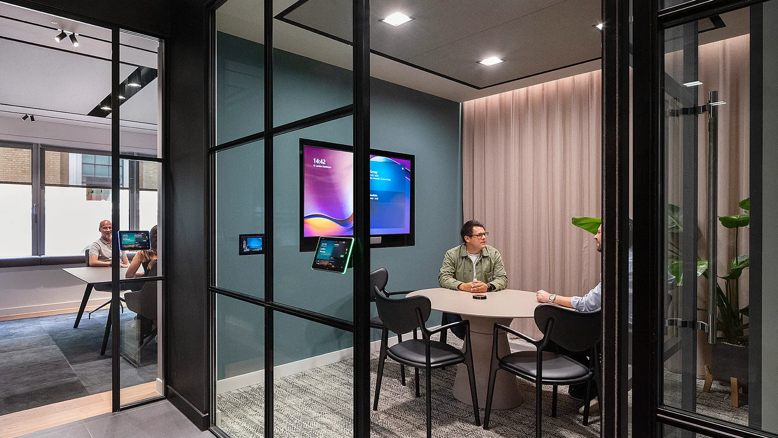 Well lit office space with glass wall for collaborative space