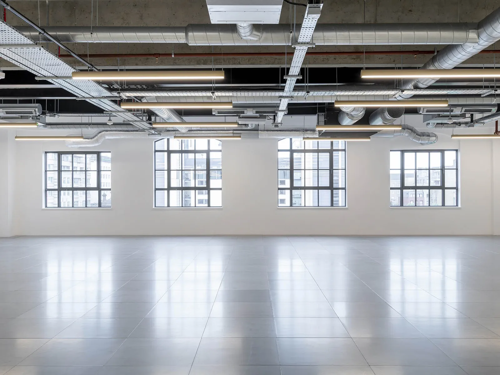 an empty workspace that has recently gone through a cat a fit out process