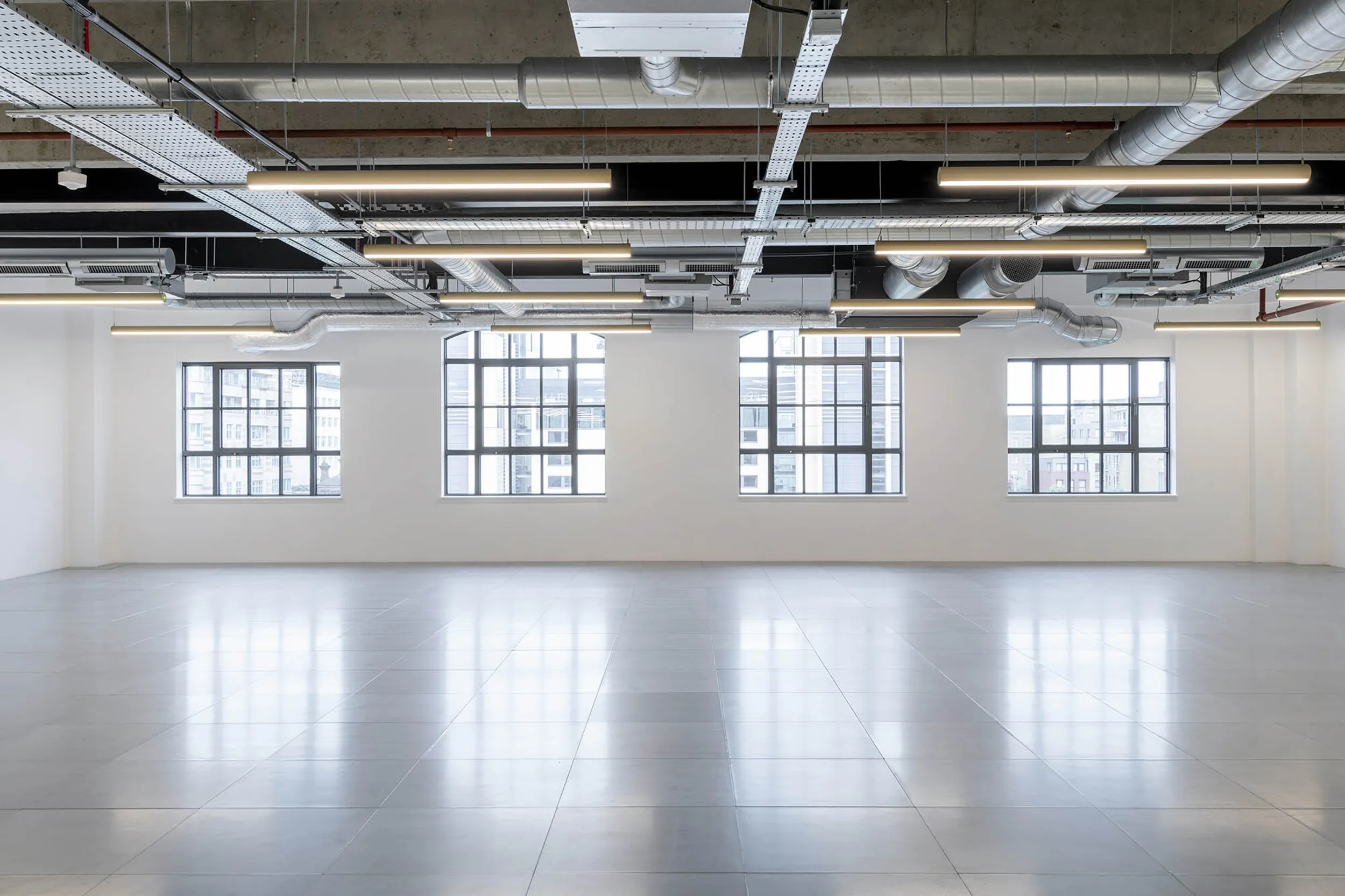 an empty workspace that has recently gone through a cat a fit out process