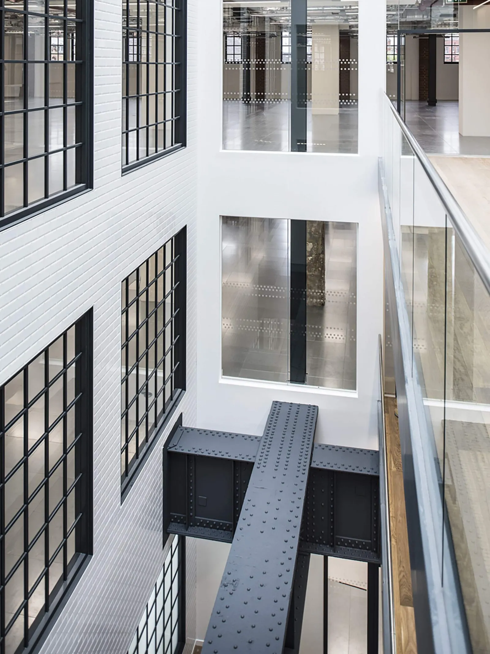 a photo from a balcony area showing a multi-story cat a fit out project by area