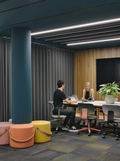 two people working in an office on sustainable furniture